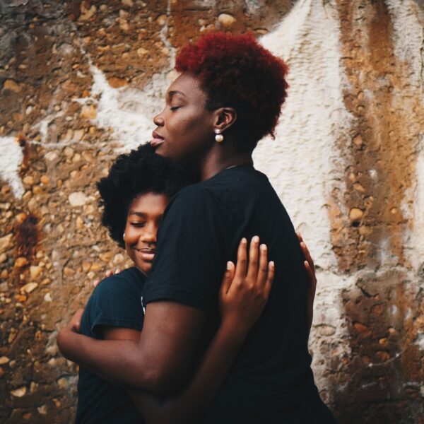 two women hugging each other