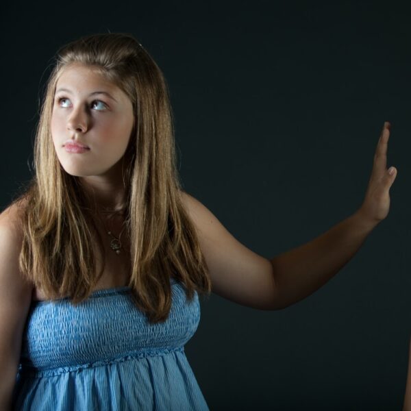 girl in blue sleeveless dress