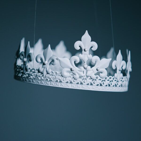 shallow focus photography white crown hanging decor